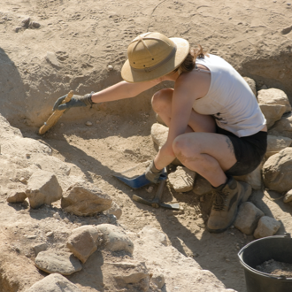 Student at excavation site for archaeological field project
